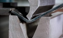 Working with sheet metal and special bending machines. hydraulic press brake or bending machine for sheet metal.
